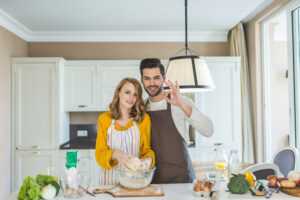 shutterstock 753960901 | Young,Couple,Making,Dough,In,Kitchen,Together